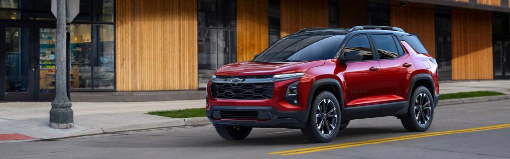 2025 Chevy Equinox Driving down an municipal street