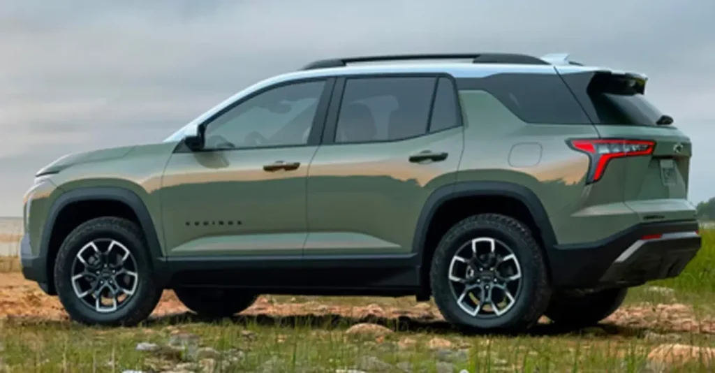 The image showcases the 2026 Chevrolet Equinox in a stylish green color, parked on rocky terrain. The SUV’s rugged design is complemented by its off-road tires, making it ready for adventure against a scenic backdrop.