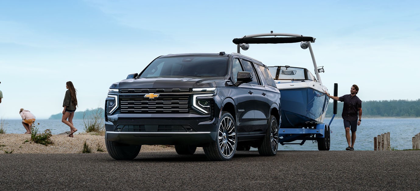 2026 Chevy Suburban towing a recreational boat showcasing impressive towing capability